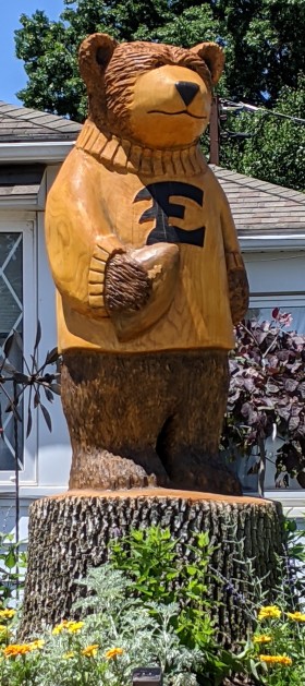 EAHS bear mascot carved out of a tree